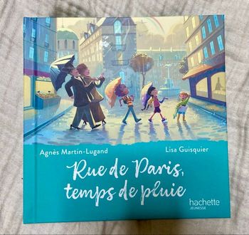 Livre rue de Paris temps de pluie mc do bon état