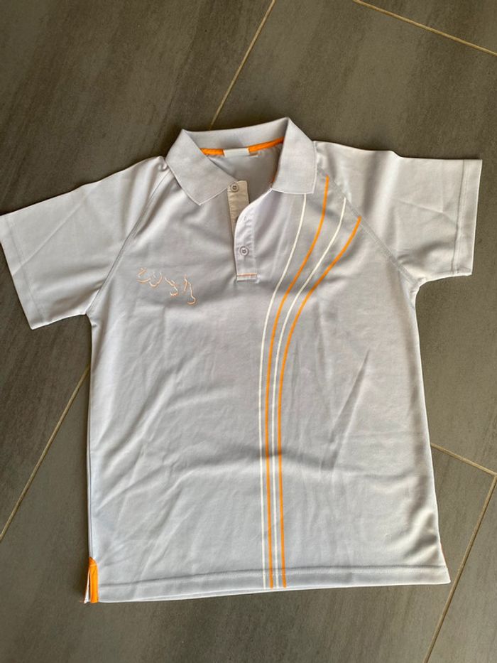 Polo de sport taille M neuf