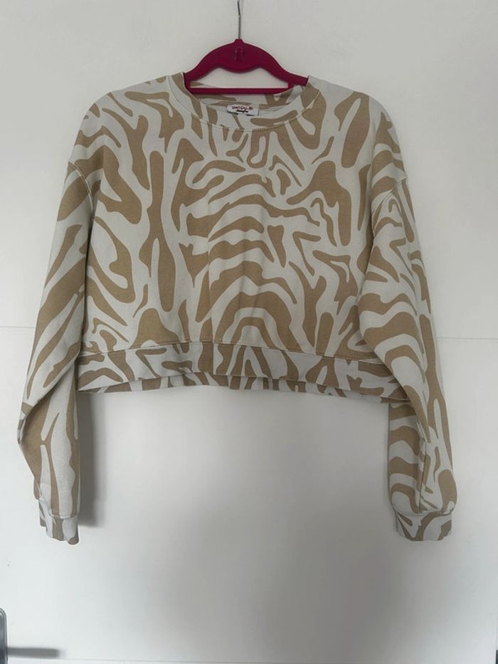 Pull court beige et blanc
