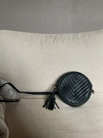 Sacoche ronde noire comme neuve