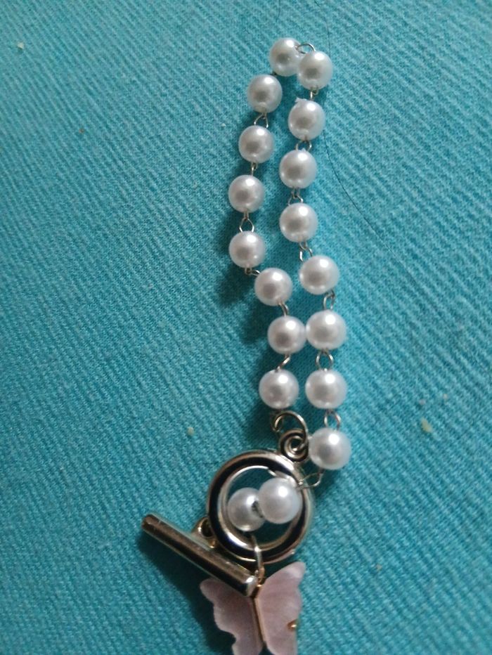 Bracelet parle paillon rose neuf