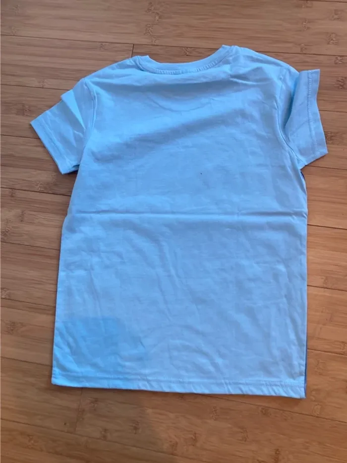 10 ans - T-shirt manches bleus  - neuf - inscription La vie douce à Maurice. - photo numéro 3