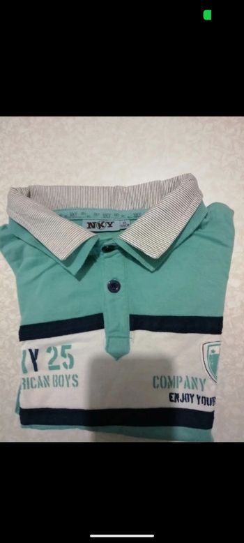 Beau Polo NKY bleu turquoise. Taille 8 ans