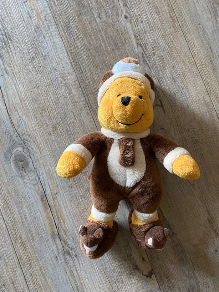 Doudou peluche Winnie deguise en ours marron Disney