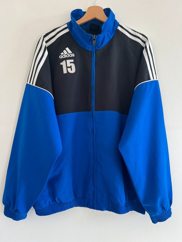 Veste de sport ( foot ) Adidas vintage taille XL couleur noir & bleue.
