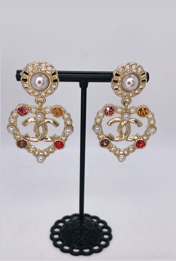 Boucles d’oreilles pendantes cœur dorées