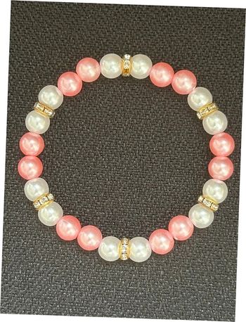 Bracelet nacré rose et doré en perles taille unique jamais porté