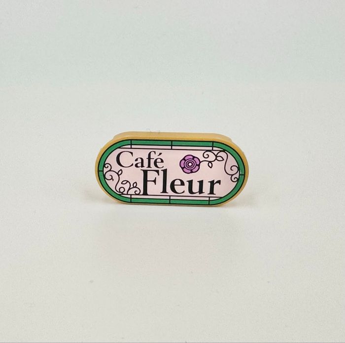 Lego Accessoires Space : Tile round 2x4 Bleu ovale Logo Café Fleur - NEUF - photo numéro 2