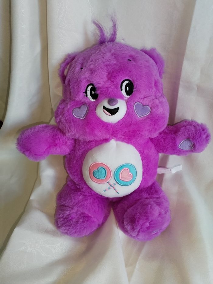 Ours en peluche violet 35 cm expression rire