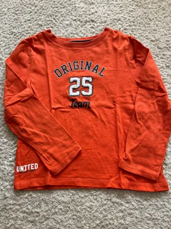 Teeshirt manches longues orange taille 6 ans marque Kiabi