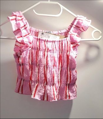 Petit haut rose bonbon taille 6 ans avec étiquette