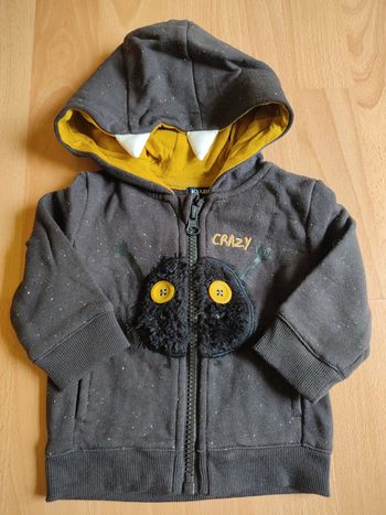 Sweat à capuche zippé noir "moucheté" et jaune neuf Kiabi en 3M