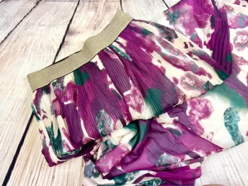 Jupe chic et élégante taille élastique dorée motifs tendance légère pour l’été