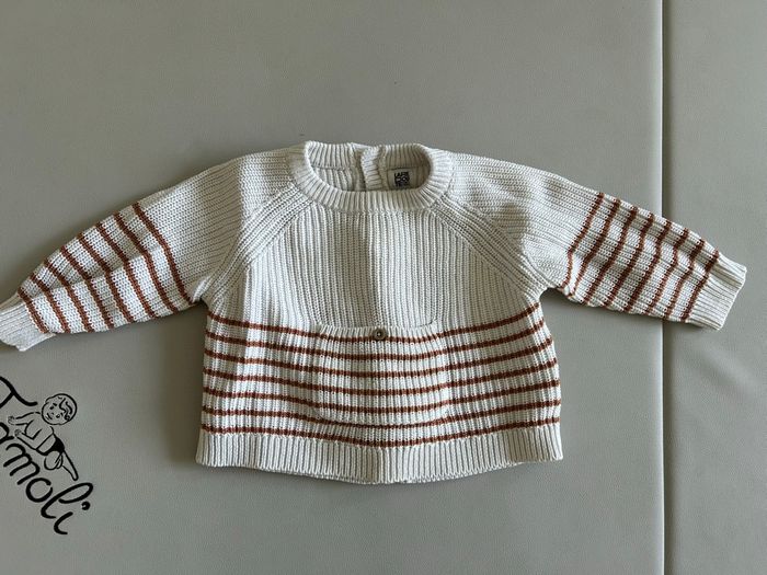 Pull rayé avec attache à l’arrière