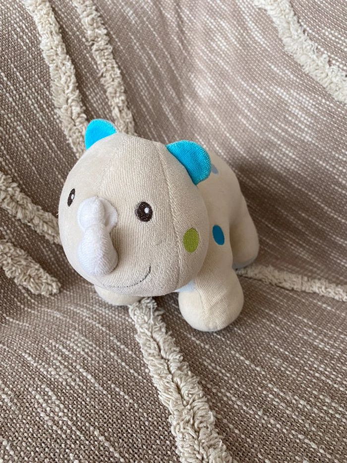 Peluche doudou 25cm sucre d’orge rhinocéros beige et bleu à pois très bon état