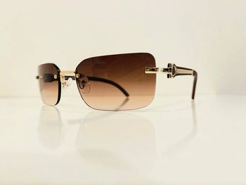 Lunette de soleil mixte percée verres marron bras effet bois UV protection catégorie 3