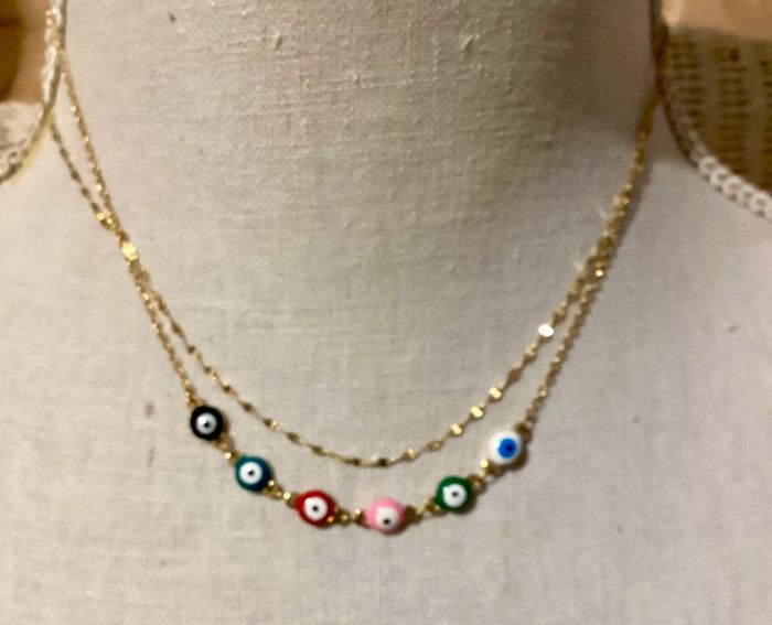 Collier 2 rangs acier inoxydable or oeils résine couleurs