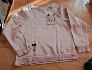 Pull rose h&m 8 ans avec motif dorée