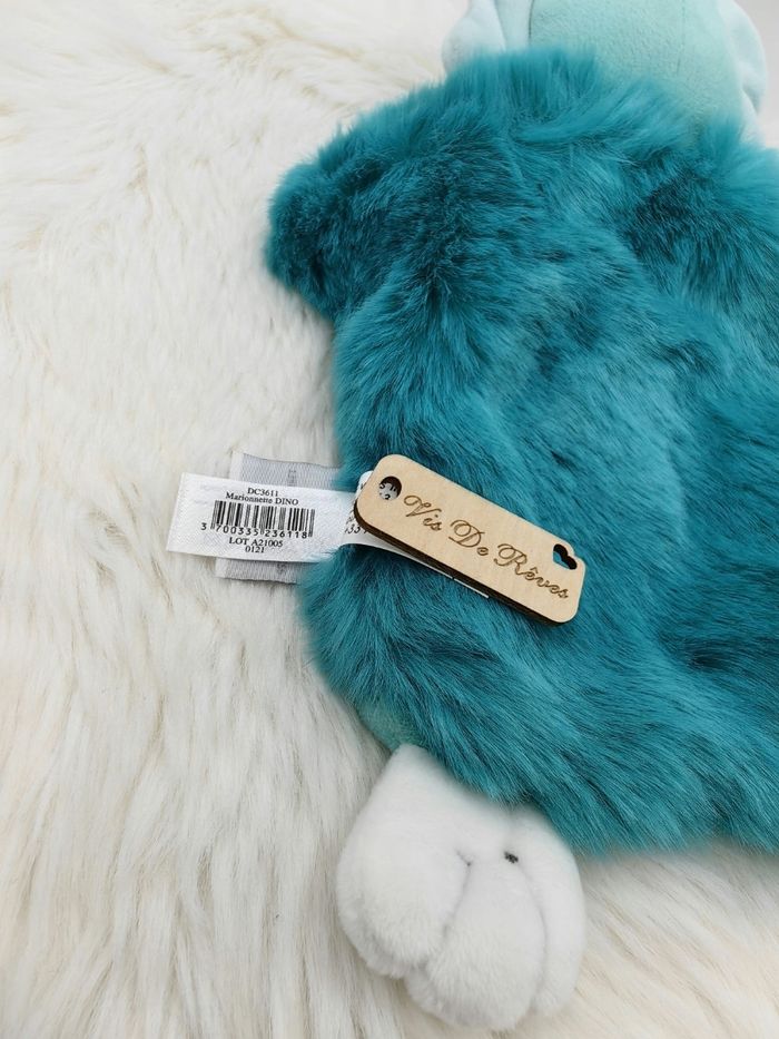 Doudou Marionnette Dino dinosaure bleu vert DC3611
Doudou et Compagnie - photo numéro 5