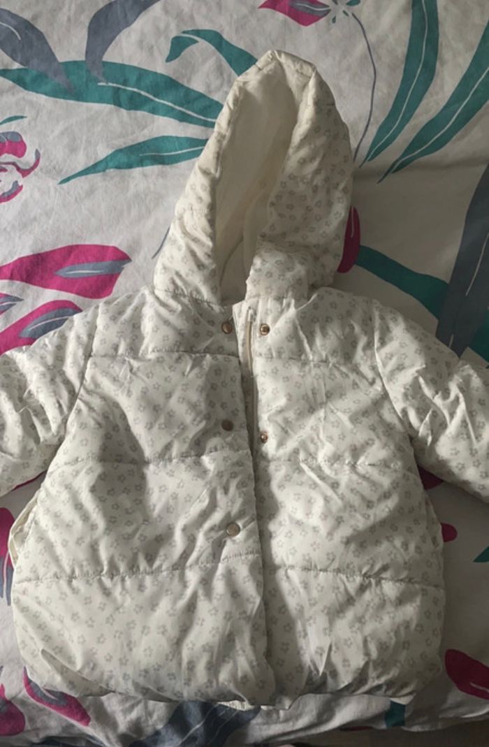 Manteau 12 mois qui tien bien chaud