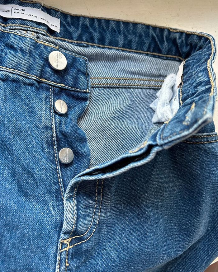 482 - jeans bleu foncé avec braguette à boutons et retaillé - photo numéro 4
