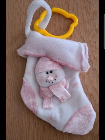 Une chaussette de Noël rose et blanche