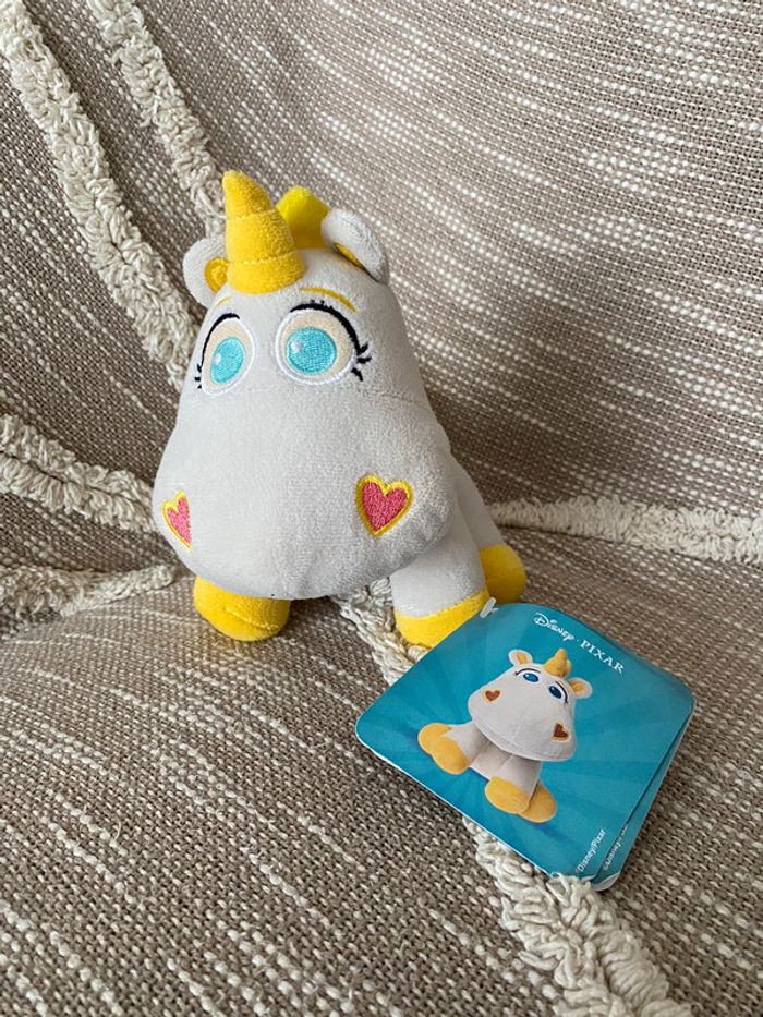 Peluche doudou 17cm Disney pixar licorne buttercup toy story gris et jaune neuve avec étiquette