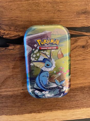 Pokémon Mini-Tin Aquali - Évolutions Prismatiques (EV8.5) - NEUF SCELLÉ FR