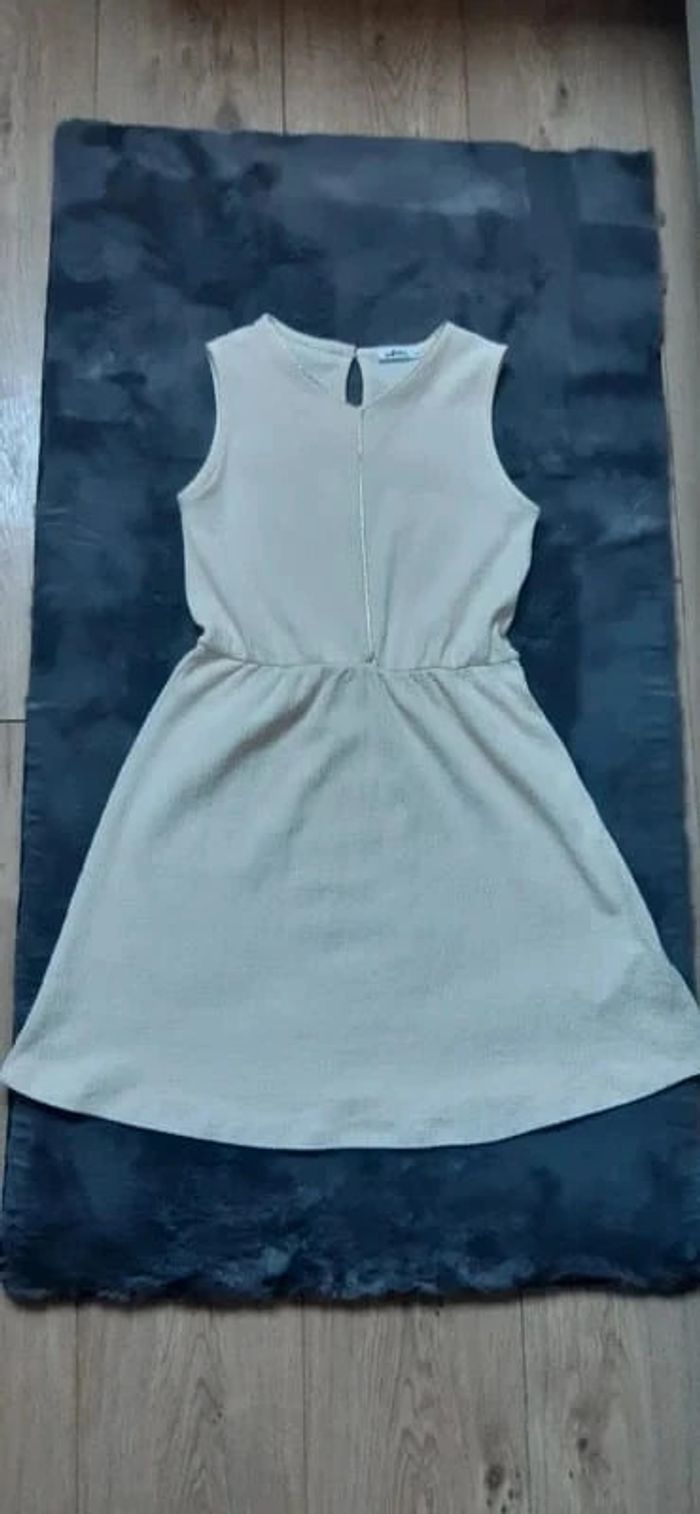 Robe gémo crème/dorée 10 ans état neuve