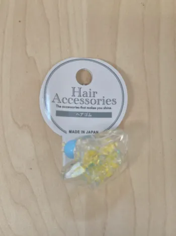 Élastique cheveux étoile à perles jaunes