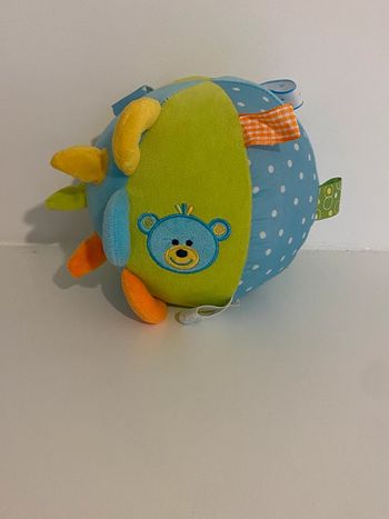 Boule peluche sensorielle, visuelle et auditive comme neuve