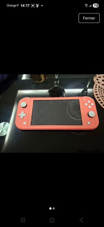Nintendo switch rose corail tres bonne etat