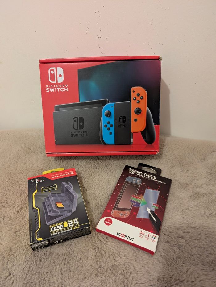 Pack Nintendo Switch + accessoires (verre trempé, boîtier jeux)  Excellent état
