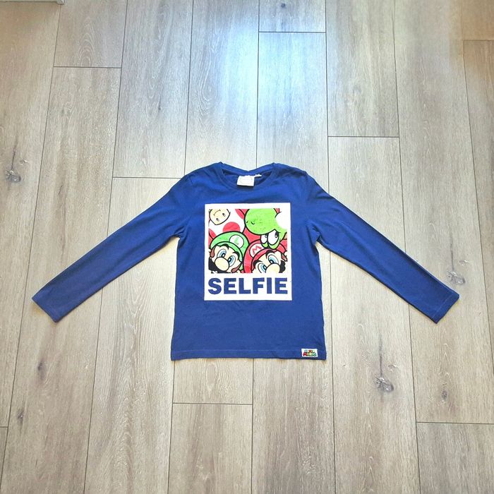 Très jolie maillot Mario bleu. Effet Graffiti. Garçon 10 ans. Marque Nintendo - photo numéro 1