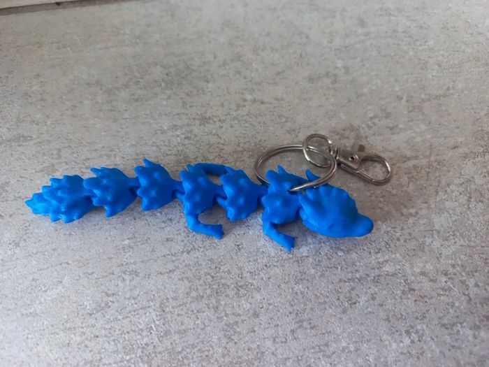 Porte clés dragon neuf bleu