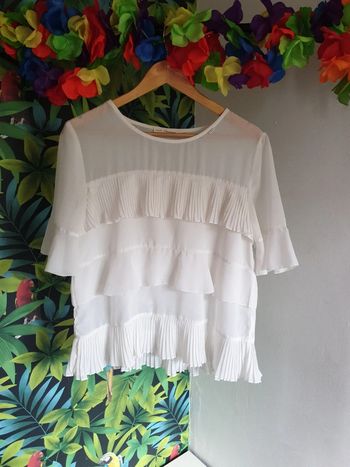 Blouse transparente à volants