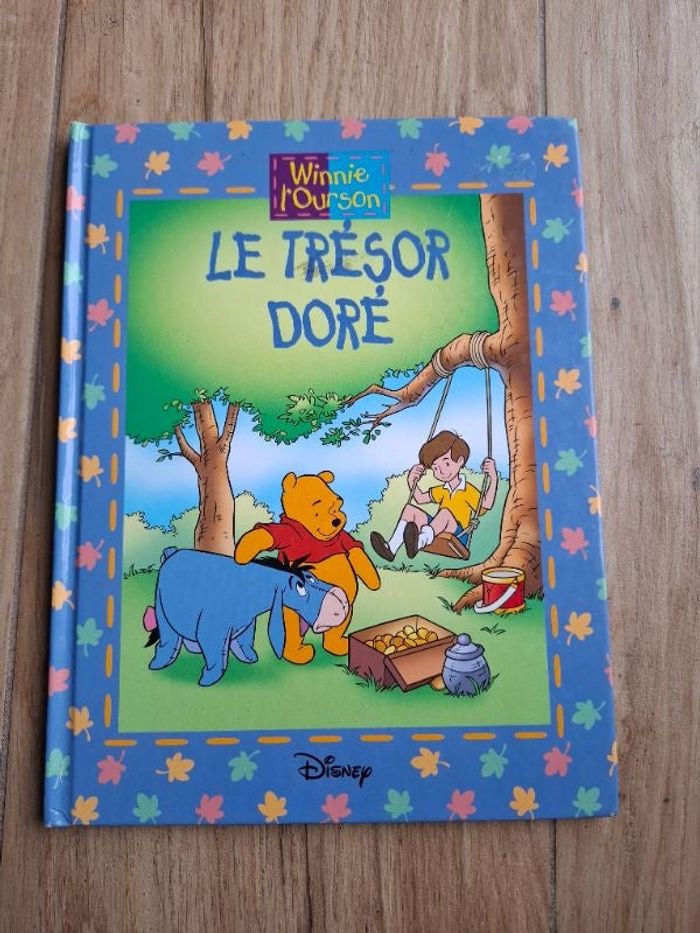 Livre Winnie l'ourson Le trésor doré en bon état