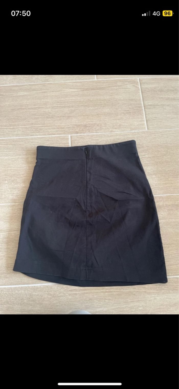 Minijupe noir effet plissé sur le côté