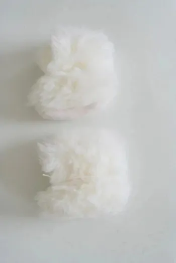 Bottillons en fourrure blanche