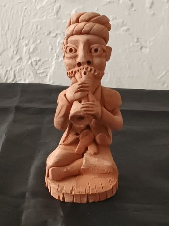 Charmeur de serpents en terre cuite 