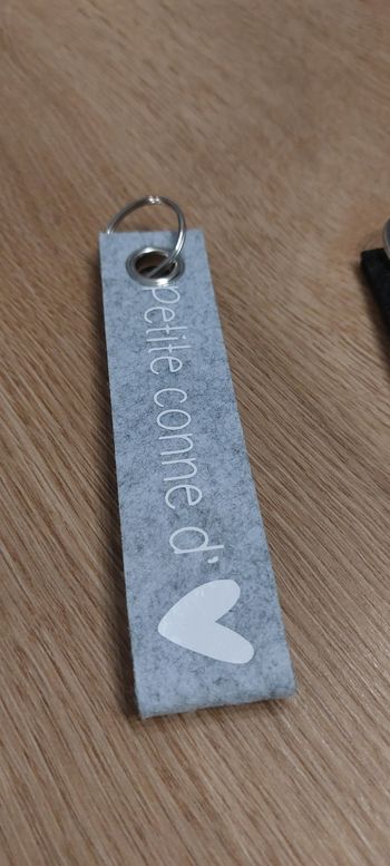 Porte clé LIRE L ANNONCE