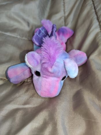 Doudou transformable licorne crotte