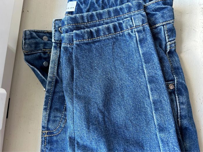 482 - jeans bleu foncé avec braguette à boutons et retaillé - photo numéro 7