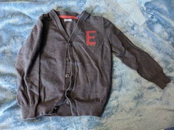 Gilet bleu marine tape a l'oeil bon état