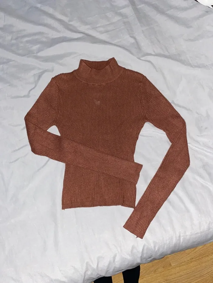 Pull col roulé