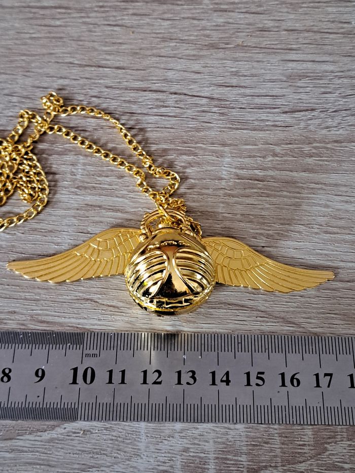Montre pendentif Harry Potter Vif d' or vendue avec une pochette - photo numéro 7