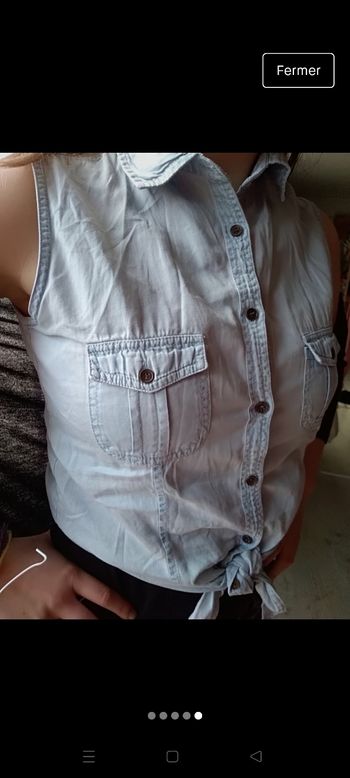 Haut sans manches.  14 ans