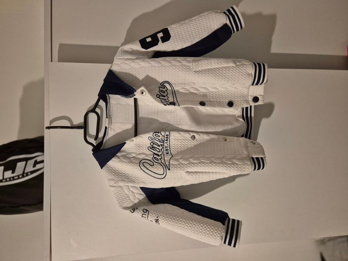 Veste Bleu et blanche 4 ans 5.00€