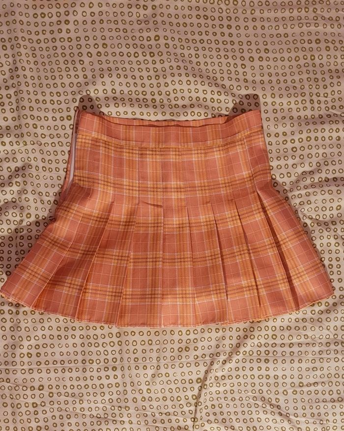 Mini jupe plissée à carreaux pêche - photo numéro 2