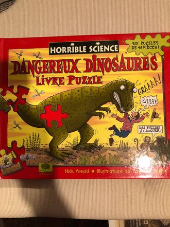 Livre avec plusieurs pages de puzzle dinosaures